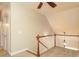 Second floor hallway with wooden banister and chandelier at 458 Leaf Arbor Ct, Clover, SC 29710