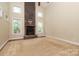 Bright living room featuring a striking stone fireplace and large windows for natural light at 458 Leaf Arbor Ct, Clover, SC 29710
