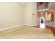 Spacious living room with neutral carpeting, high ceilings, and a view of the foyer at 458 Leaf Arbor Ct, Clover, SC 29710
