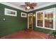 Charming covered patio with wood flooring, large windows, and ceiling fan, creating a comfortable outdoor living space at 458 Leaf Arbor Ct, Clover, SC 29710