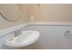 Cozy powder room featuring a pedestal sink and stylish wall paneling at 458 Leaf Arbor Ct, Clover, SC 29710