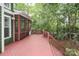 View of the spacious wooden deck with railing and covered patio at 458 Leaf Arbor Ct, Clover, SC 29710