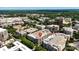 Aerial view of buildings with parking garages and rooftop pools in a lush landscape with surrounding buildings at 4625 Piedmont Row Dr # 712, Charlotte, NC 28210