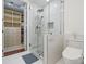 Bathroom with glass enclosed shower, a walk-in closet, and a toilet at 4625 Piedmont Row Dr # 712, Charlotte, NC 28210