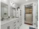 Bright, well-lit bathroom features dual sinks and a walk-in closet at 4625 Piedmont Row Dr # 712, Charlotte, NC 28210