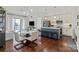 Open living space with a balcony, hardwood floors, and stylish furnishings at 4625 Piedmont Row Dr # 712, Charlotte, NC 28210