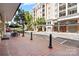 Charming street with brick sidewalks and inviting storefronts, with outdoor seating at local establishments at 4625 Piedmont Row Dr # 712, Charlotte, NC 28210