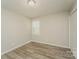 Well-lit bedroom with neutral walls, modern flooring, and a closet, perfect for relaxation and storage at 4937 Post Oak Ln, Rock Hill, SC 29732