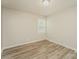 Serene bedroom with neutral walls, wood-look flooring, and natural light creating a cozy atmosphere at 4937 Post Oak Ln, Rock Hill, SC 29732