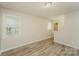 Neutral bedroom with ample natural light and wood-look floors, offering a calming space at 4937 Post Oak Ln, Rock Hill, SC 29732