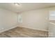 Neutral bedroom with ample natural light and wood-look floors, offering a calming space at 4937 Post Oak Ln, Rock Hill, SC 29732