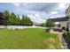 Expansive backyard featuring a patio, lawn, and fenced perimeter at 5042 Alston Dr, Lancaster, SC 29720