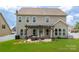 Home exterior showcasing the patio with pergola overlooking a spacious yard at 5042 Alston Dr, Lancaster, SC 29720