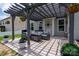 Back patio with comfortable furniture under a shaded pergola at 5042 Alston Dr, Lancaster, SC 29720