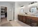 Spacious bathroom with double vanity sinks, granite countertops, modern lighting, and a separate toilet room at 5042 Alston Dr, Lancaster, SC 29720