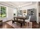 Bright dining room featuring a large table, elegant lighting, and stylish built-in cabinets for sophisticated entertaining at 5042 Alston Dr, Lancaster, SC 29720