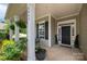 Inviting front porch with classic columns and seating area, perfect for relaxing and enjoying the neighborhood views at 5042 Alston Dr, Lancaster, SC 29720