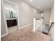 Upstairs hallway featuring a carpeted floor and a view of a bathroom, stairway, and other rooms at 5042 Alston Dr, Lancaster, SC 29720