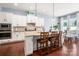 Spacious kitchen featuring a center island, white cabinetry, and stainless steel appliances for a modern and functional space at 5042 Alston Dr, Lancaster, SC 29720