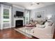 Inviting living room with a cozy fireplace, neutral decor, hardwood floors, and lots of natural light at 5042 Alston Dr, Lancaster, SC 29720
