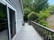 Back deck and railing, with mature trees in the background at 6007 Crosswood Ct, Charlotte, NC 28215