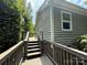 Spacious back deck with railing and steps up to the yard at 6007 Crosswood Ct, Charlotte, NC 28215