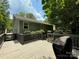 Back deck with space for a grill, overlooking a secluded backyard at 6007 Crosswood Ct, Charlotte, NC 28215