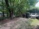 View of the backyard with treed backdrop at 6007 Crosswood Ct, Charlotte, NC 28215