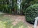 View of the secluded backyard and surrounding wooded area at 6007 Crosswood Ct, Charlotte, NC 28215