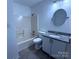 Clean bathroom featuring a tub/shower combination and a granite countertop vanity at 6007 Crosswood Ct, Charlotte, NC 28215