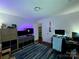 Bright bedroom featuring blue accent lighting and a functional setup for computer and study at 6007 Crosswood Ct, Charlotte, NC 28215
