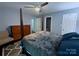 Spacious bedroom with a ceiling fan and a four-post bed at 6007 Crosswood Ct, Charlotte, NC 28215