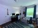 Bedroom featuring wood-look flooring, natural light, neutral paint, and a dedicated desk space at 6007 Crosswood Ct, Charlotte, NC 28215