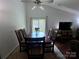 Dining area with a wooden table, six chairs, and large windows allowing natural light at 6007 Crosswood Ct, Charlotte, NC 28215
