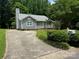 A charming exterior view with a well-kept lawn and driveway at 6007 Crosswood Ct, Charlotte, NC 28215