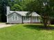Charming single-story home with a well-maintained lawn and inviting front porch at 6007 Crosswood Ct, Charlotte, NC 28215