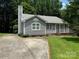 Charming single-story home with a well-manicured lawn and a concrete driveway at 6007 Crosswood Ct, Charlotte, NC 28215