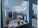 Bright kitchen featuring white cabinets, stainless steel appliances, and tile flooring at 6007 Crosswood Ct, Charlotte, NC 28215