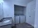Cozy laundry with tile flooring, granite counters, washer and dryer hookups, and neutral paint at 6007 Crosswood Ct, Charlotte, NC 28215