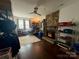 Inviting living room with stone fireplace, ceiling fan, and hardwood floors at 6007 Crosswood Ct, Charlotte, NC 28215