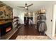 Cozy living room with stone fireplace, ceiling fan, and ample storage at 6007 Crosswood Ct, Charlotte, NC 28215