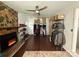 Unique living room features a stone fireplace, ceiling fan, storage, and hardwood flooring at 6007 Crosswood Ct, Charlotte, NC 28215