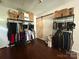 Spacious storage area with hanging racks and a charming sliding barn door at 6007 Crosswood Ct, Charlotte, NC 28215