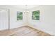 Dining room with hardwood floors and natural light from two windows at 61 23Rd Nw St, Hickory, NC 28601