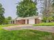 Brick home with a covered side porch, attached garage and concrete driveway at 61 23Rd Nw St, Hickory, NC 28601