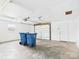 A spacious garage interior with concrete flooring, overhead door, and access door at 61 23Rd Nw St, Hickory, NC 28601