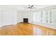 Spacious living room with hardwood floors, fireplace, ceiling fan, and natural light at 61 23Rd Nw St, Hickory, NC 28601