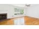 Living room featuring hardwood floors, a fireplace, and lots of natural light at 61 23Rd Nw St, Hickory, NC 28601