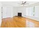 Living room with hardwood floors, fireplace, ceiling fan and natural light at 61 23Rd Nw St, Hickory, NC 28601