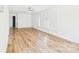 Spacious living room with natural light, ceiling fan, and hardwood floors at 61 23Rd Nw St, Hickory, NC 28601